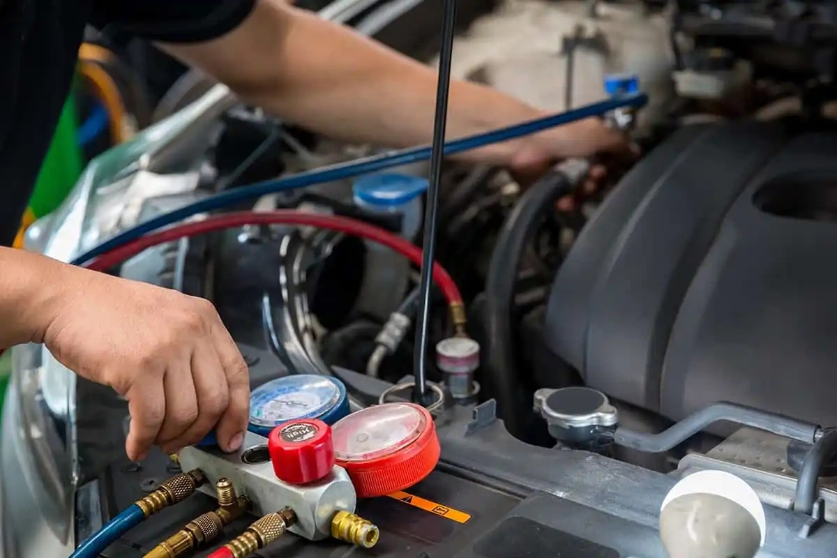 Car Mechanic Is Doing A Job Of Car Ac Repair At London Motor Sports