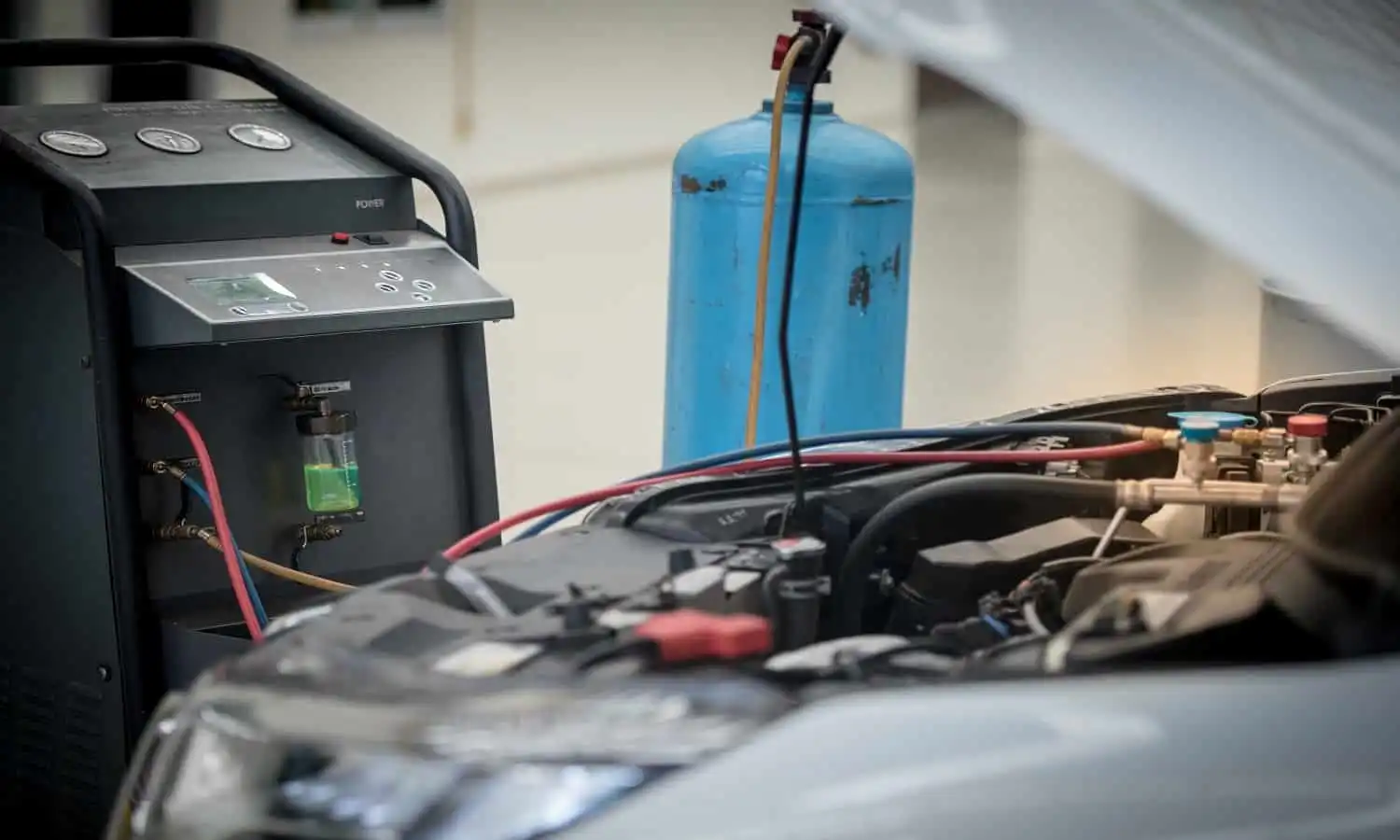 Car Mechanic Is Doing A Job Of Car Ac Repair At London Motor Sports