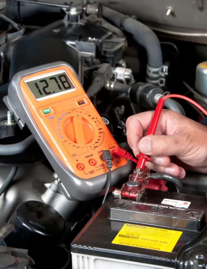 Auto Electrician Is Testing The Car Battery